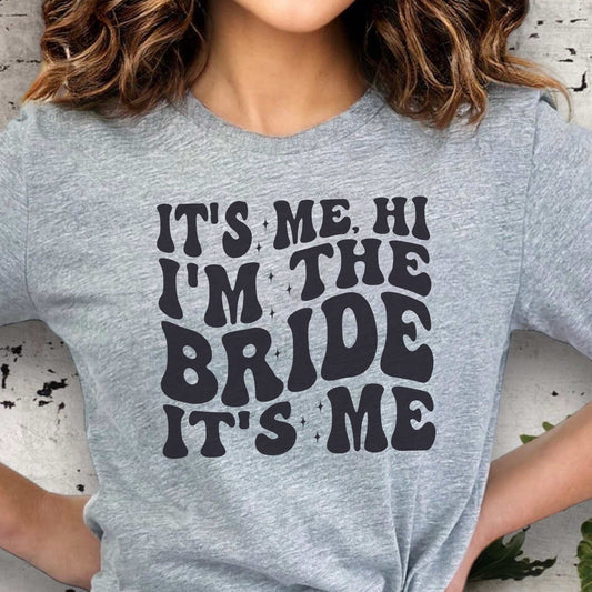 Custom bachelorette party shirt for brides-to-be with "It's Me, Hi I’m the Bride" text in bold font.