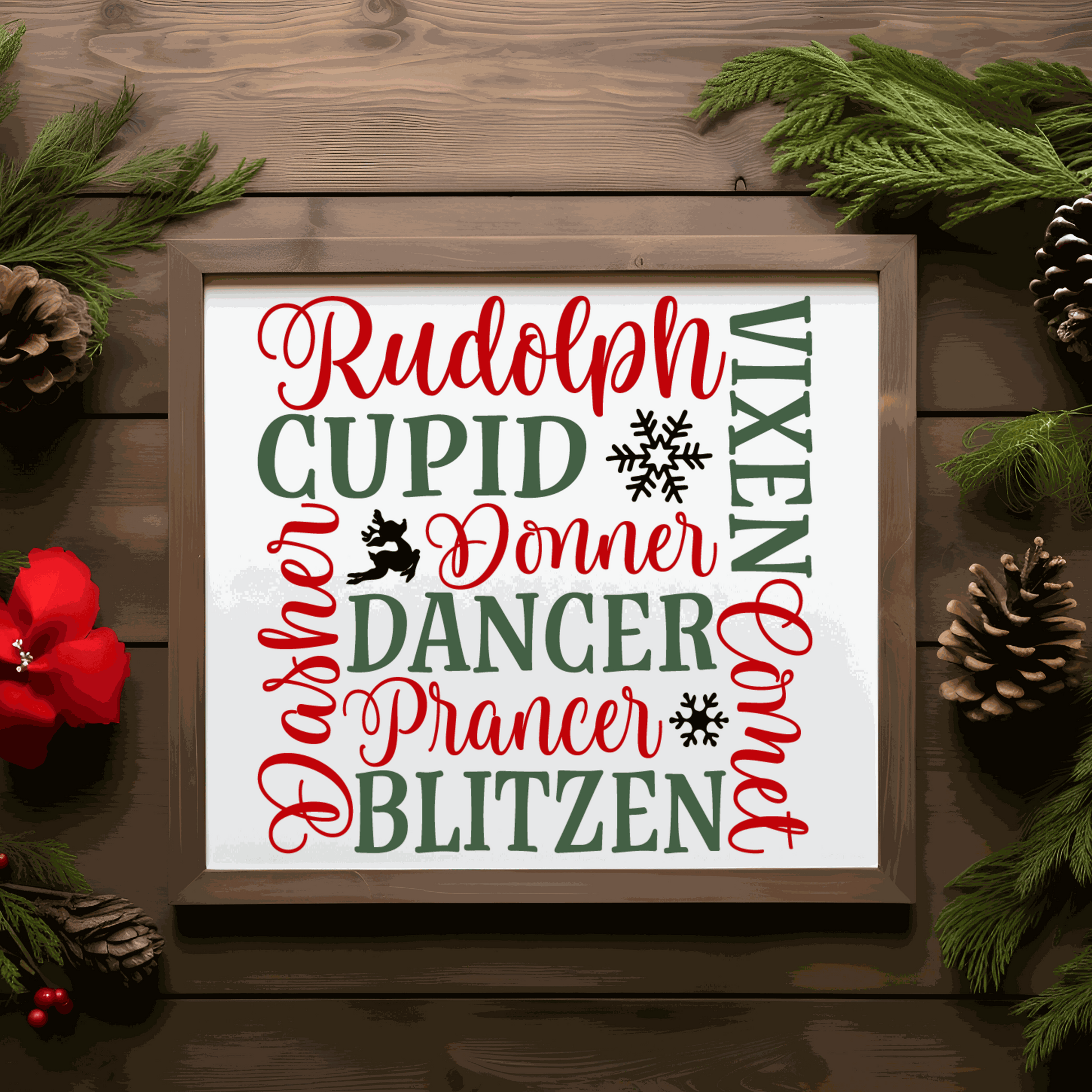 Handmade reindeer names Christmas wood sign with red and green lettering.