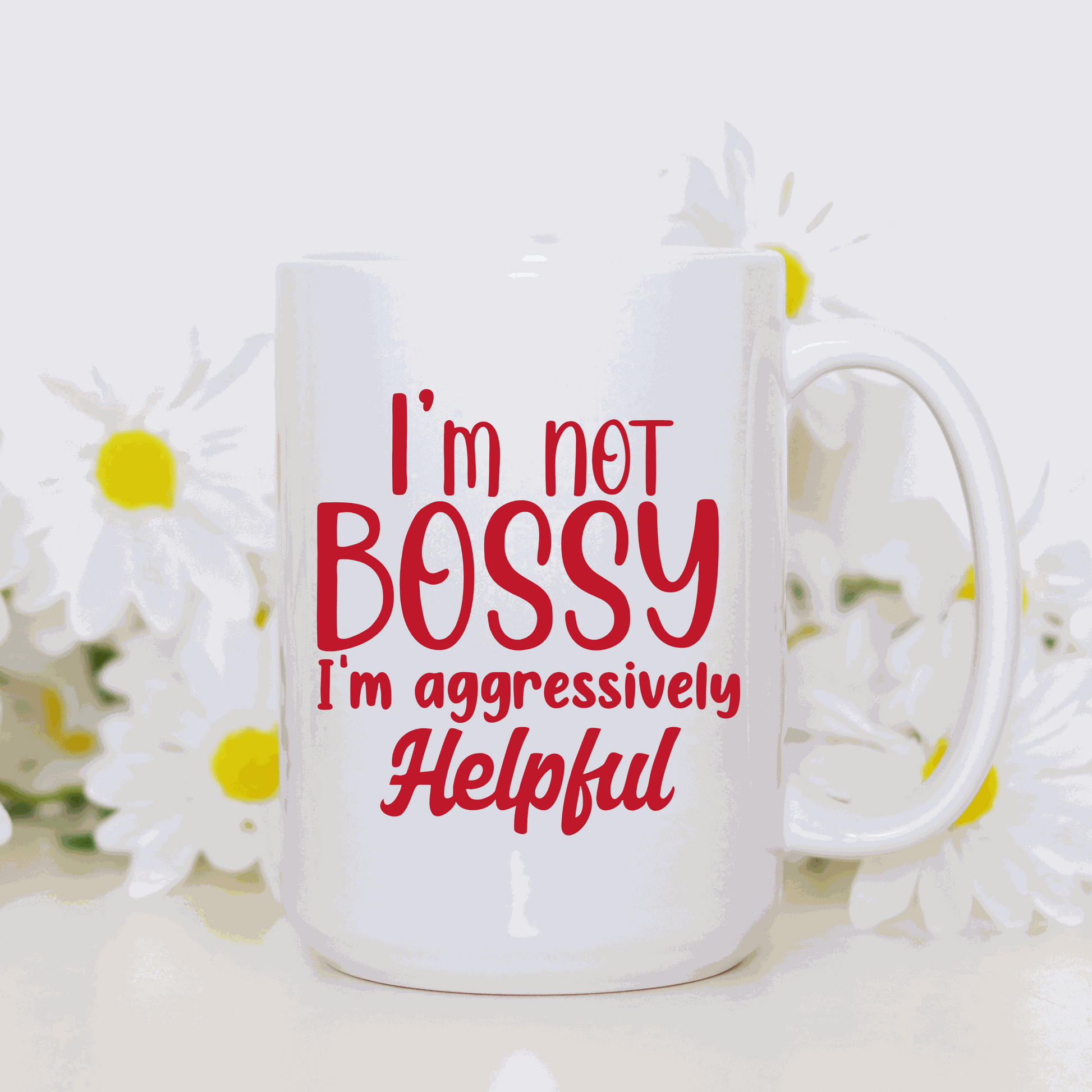 Ceramic mug with "I'm Not Bossy, I'm Aggressively Helpful" printed on both sides, 15 oz, made in Canada.