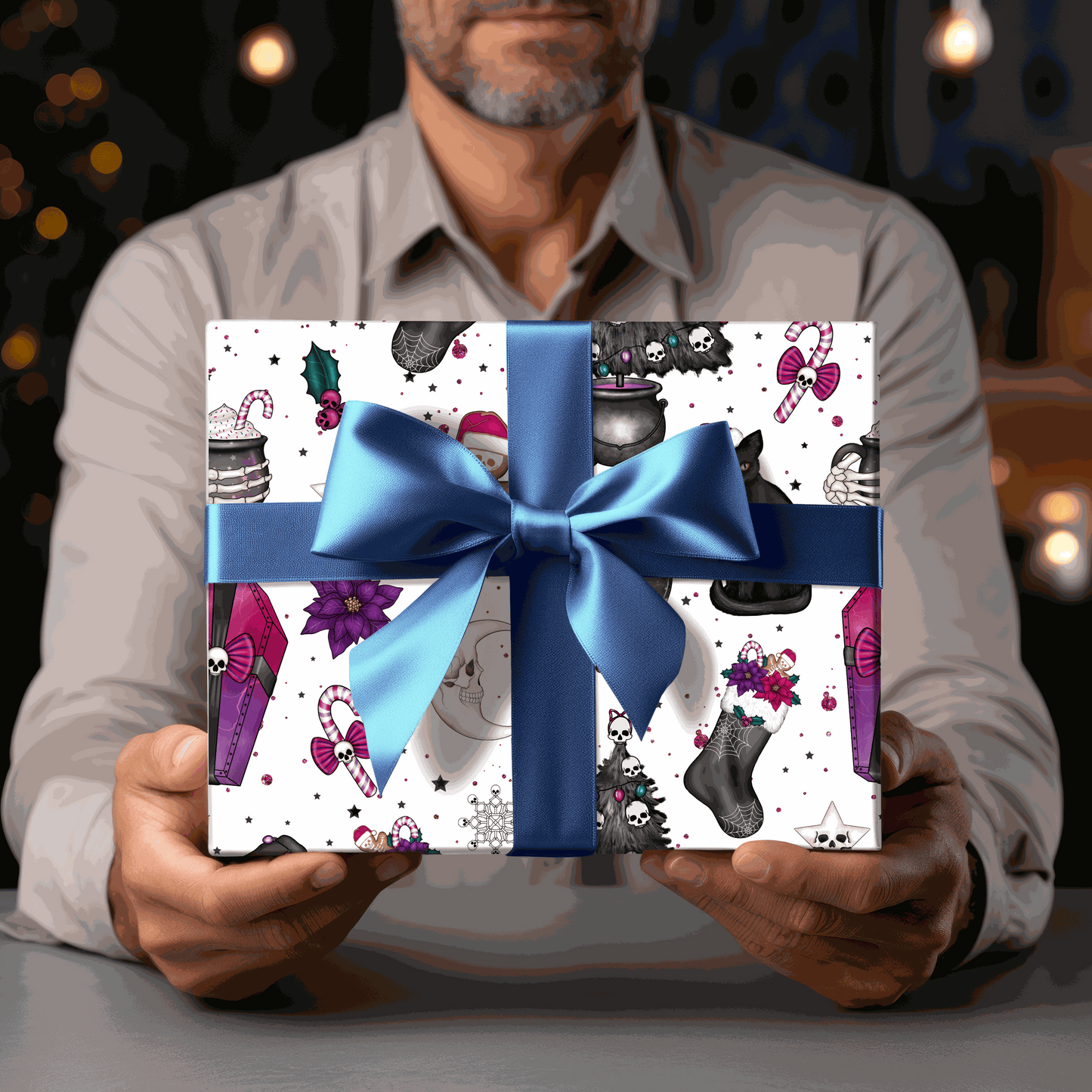 Gothic style Christmas gift wrapped in black cat wrapping paper with blue bow.