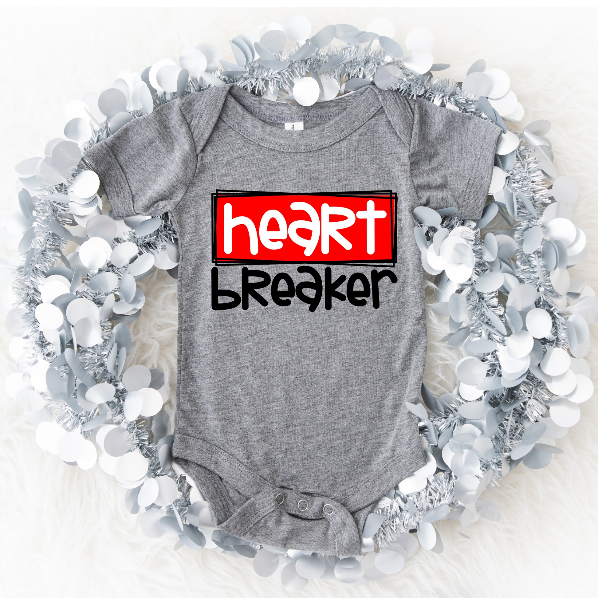 Customizable baby onesie with "Heart Breaker" design, 100% cotton, perfect for personalized pregnancy announcements or baby gifts.