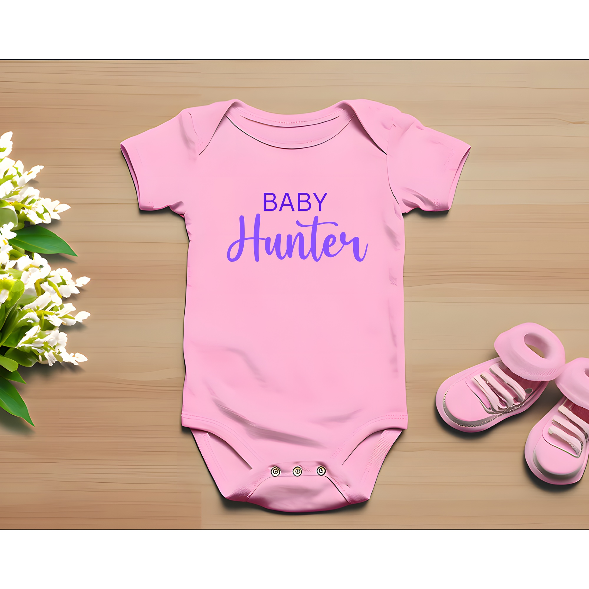 Customizable pink baby onesie with "Baby Hunter" text, perfect for pregnancy announcements or