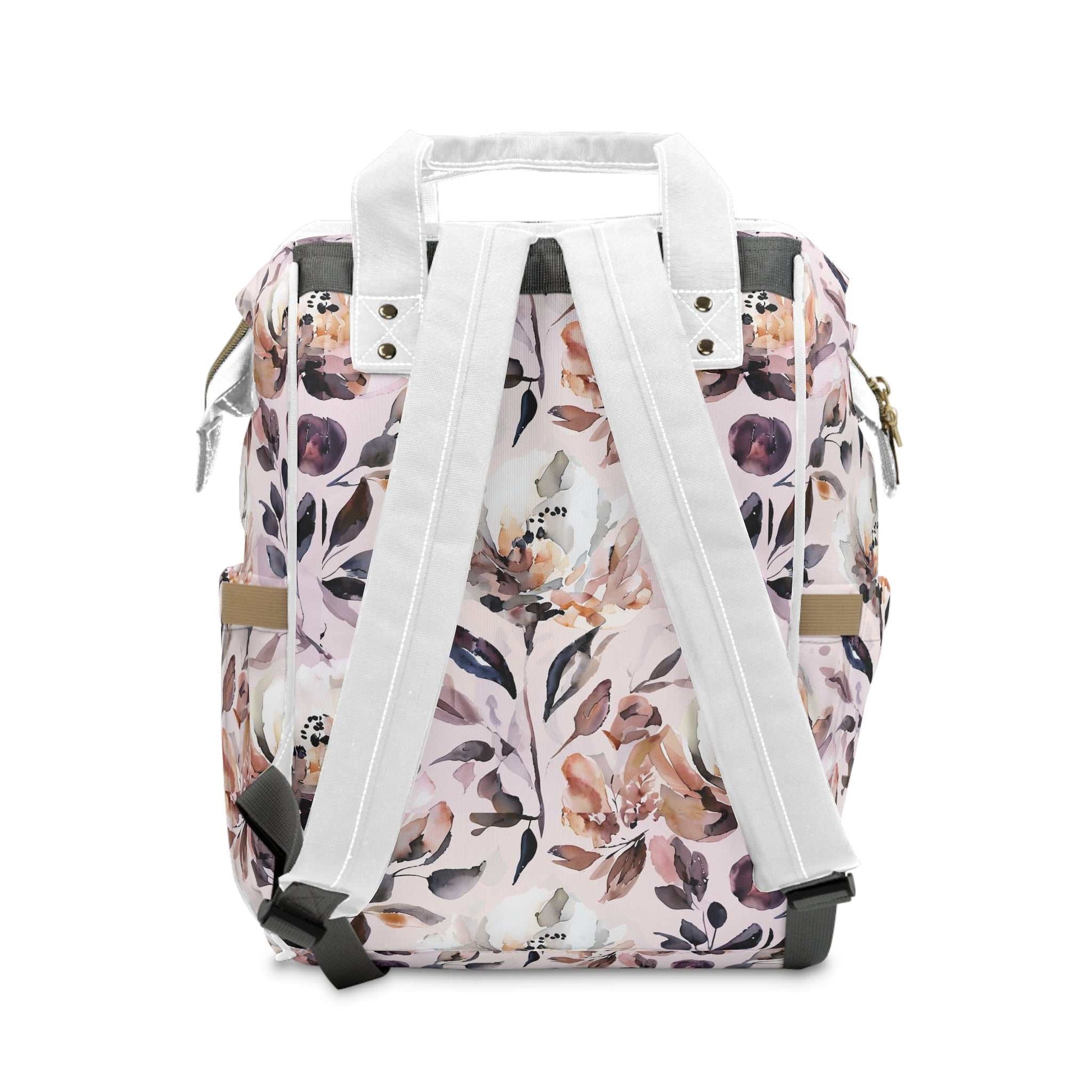 Floral diaper bag backpack in pink with white straps, ideal for carrying baby essentials and perfect for new moms.