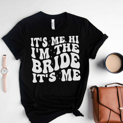Custom bachelorette party shirt for brides-to-be with "It's Me, Hi I'm the Bride" text, perfect for events and bridal celebrations.