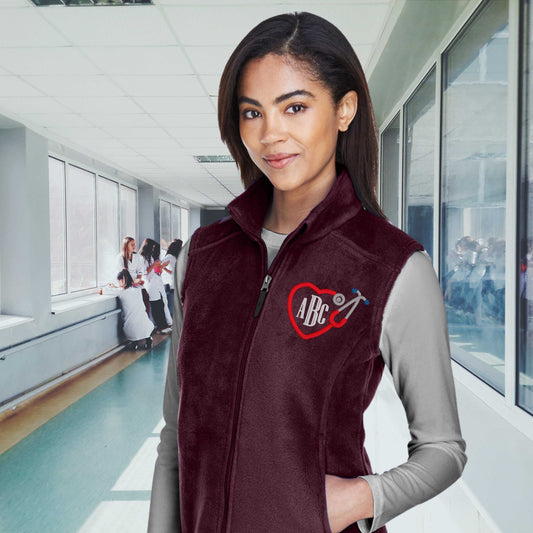 Ladies personalized full zip vest for registered nurses with monogram, fleece material.