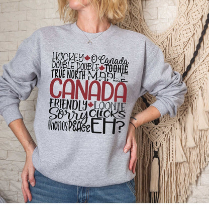 Cozy grey unisex fleece sweatshirt with Canada-themed word art design.