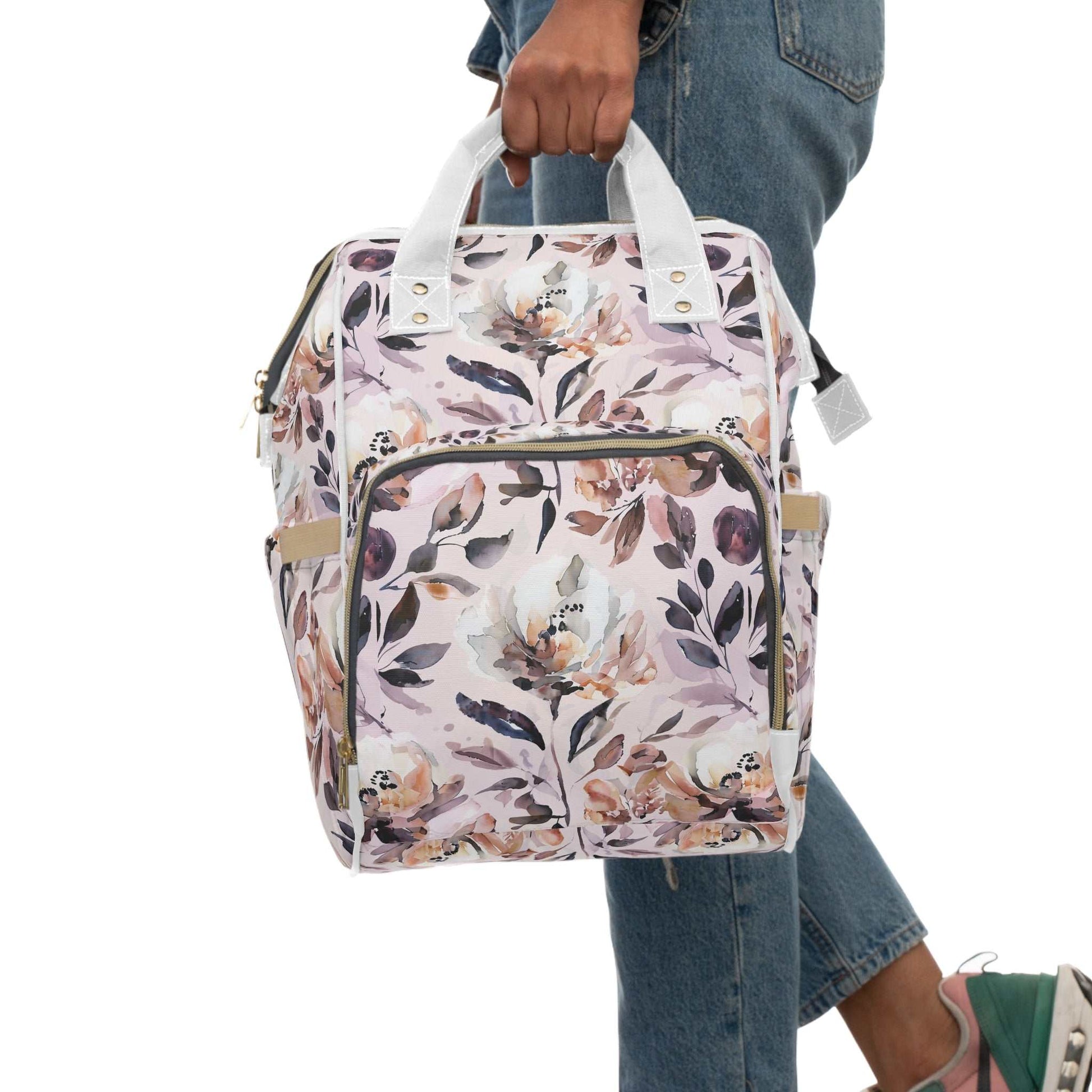 Floral diaper bag backpack with pink and white design, perfect for baby essentials and gifts.