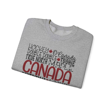 Cozy unisex Canada word art fleece sweatshirt featuring patriotic collage, ideal for Canadians and tourists.