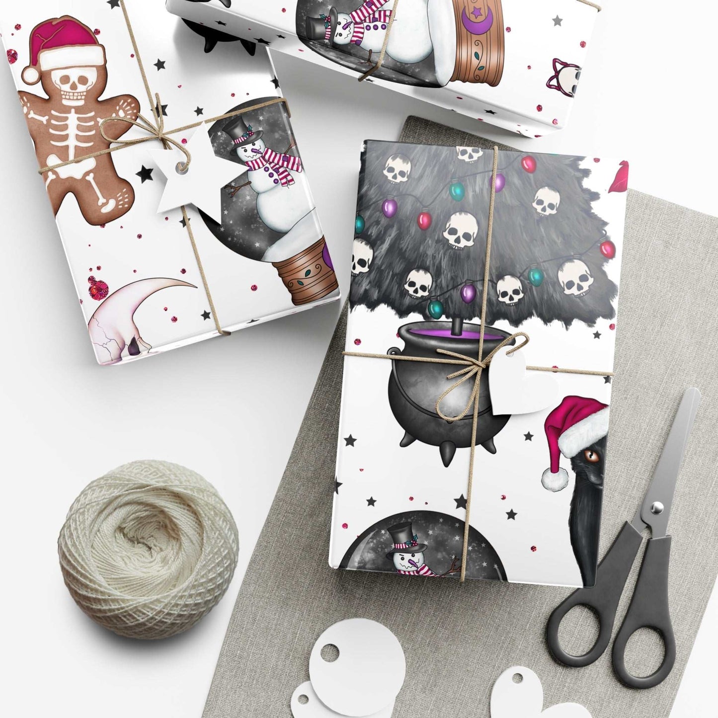 Gothic style Christmas wrapping paper with black cat design and spooky holiday elements, including skulls and cauldrons.