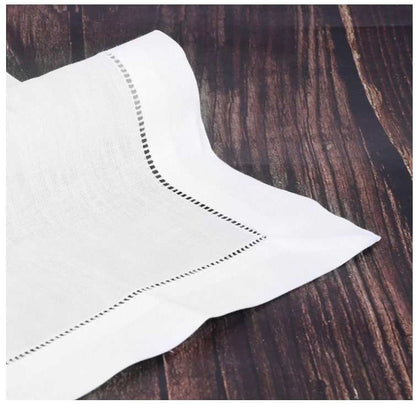 Reusable cloth napkin with nature-themed botanical design, cream white linen blend with hemstitch finish.
