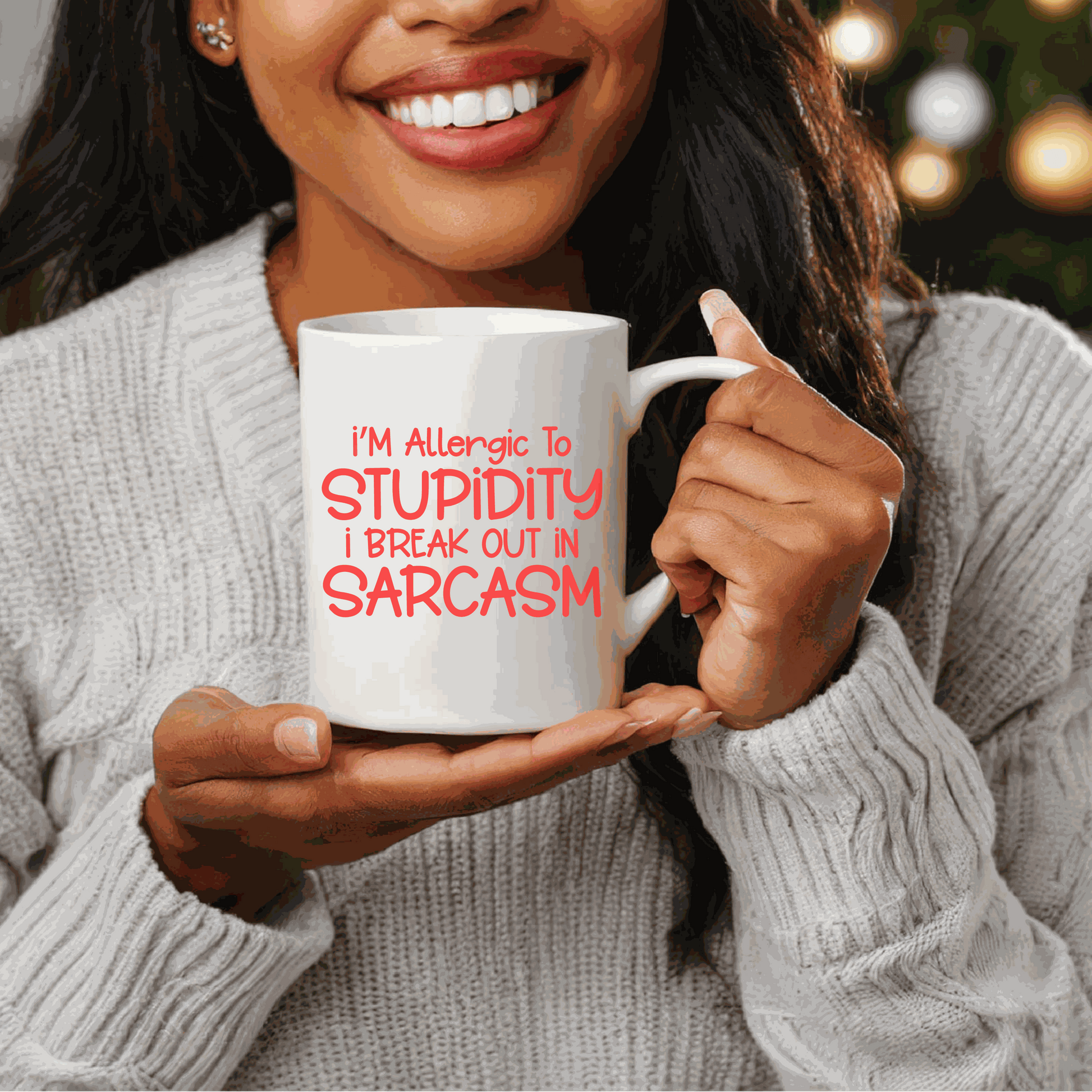 Ceramic coffee mug with "I'm Allergic to Stupidity" design, perfect humorous gift.