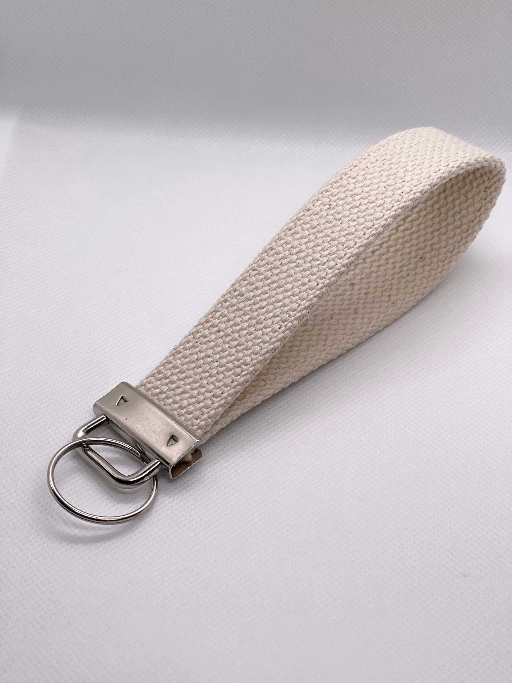 Personalized canvas keychain wristlet with metal hardware, cotton webbing.