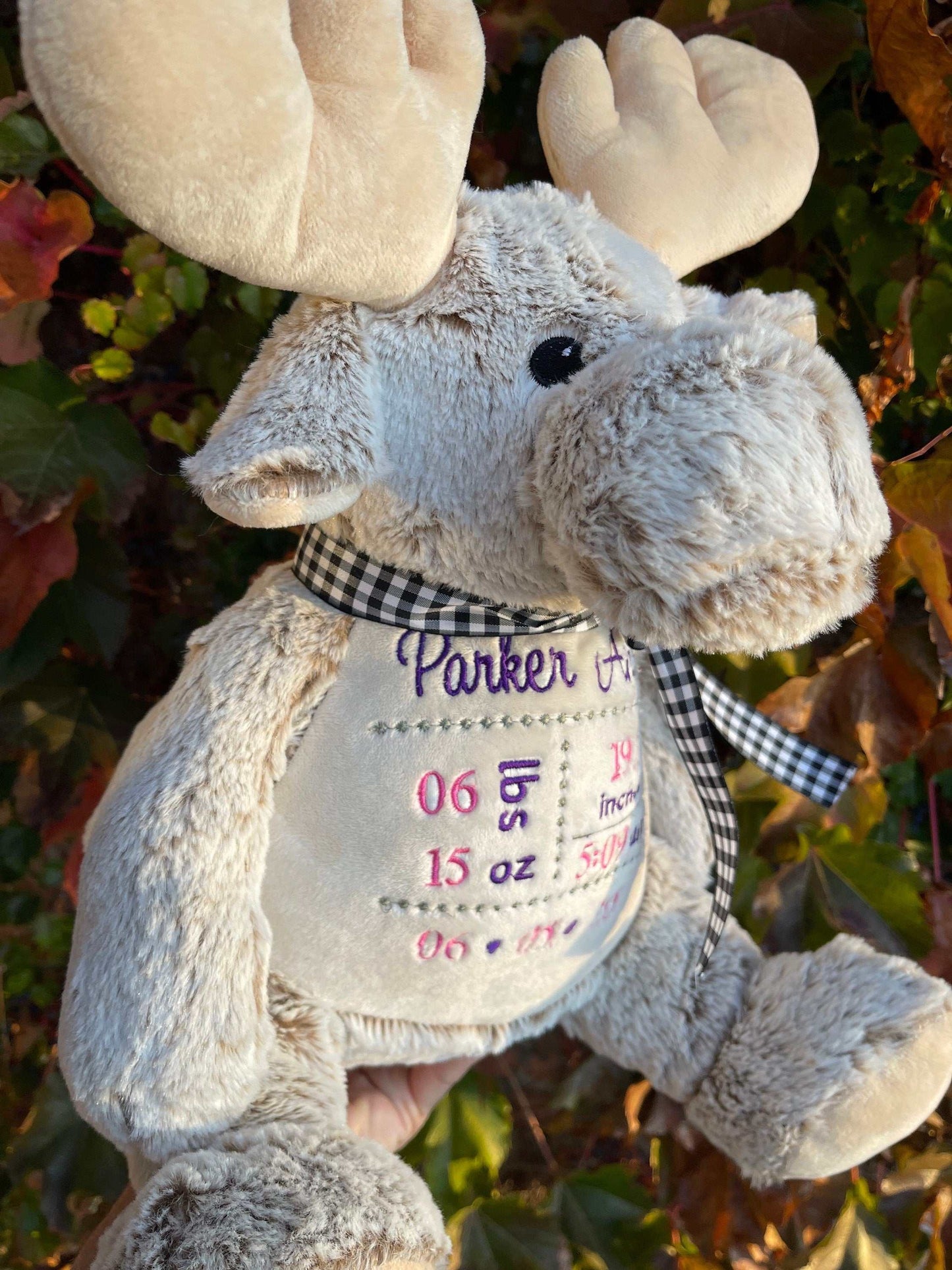 Personalized birth stat embroidered moose plush toy with customizable details.