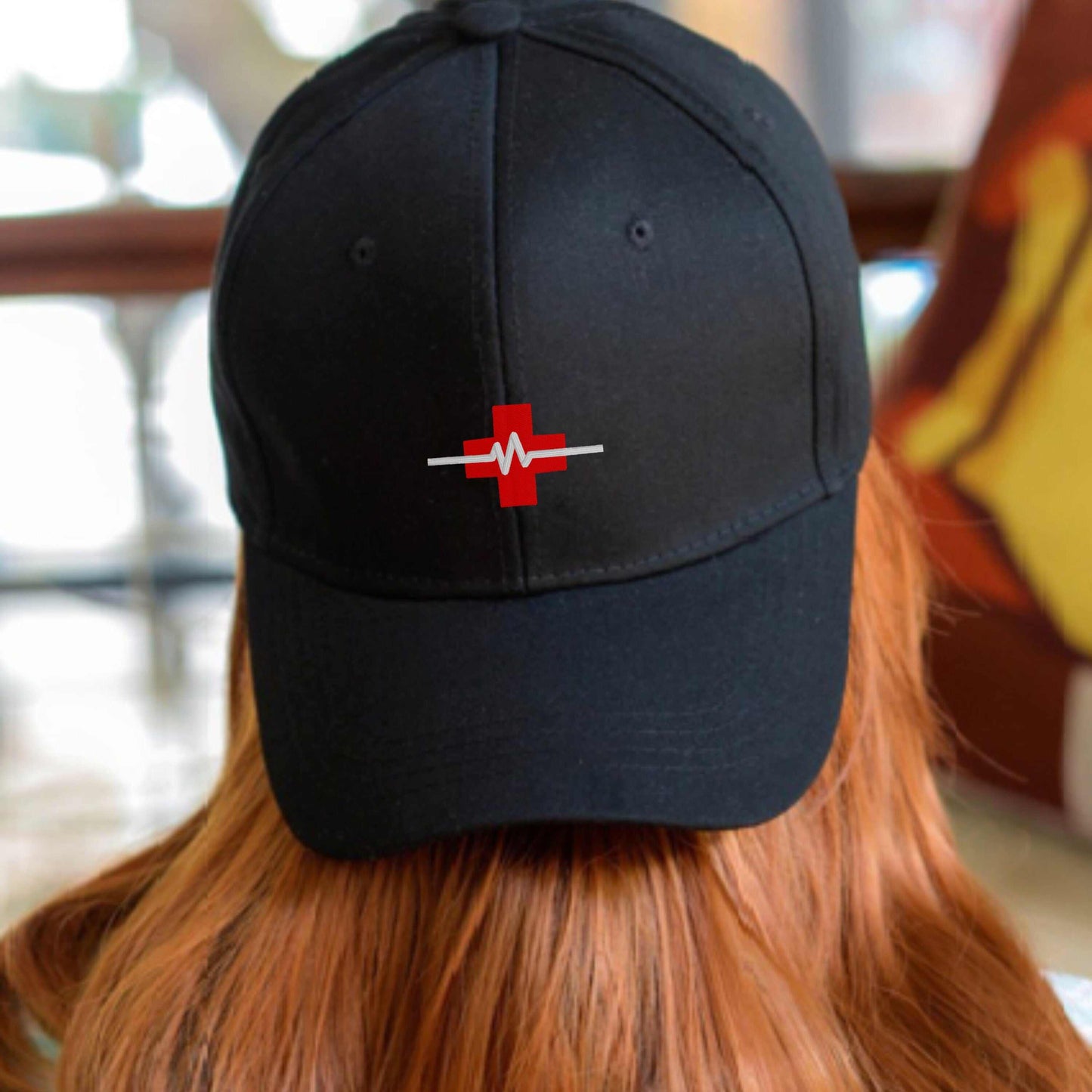 Nurse embroidered cap with red cross and heartbeat design, ideal gift for nursing students and graduates.