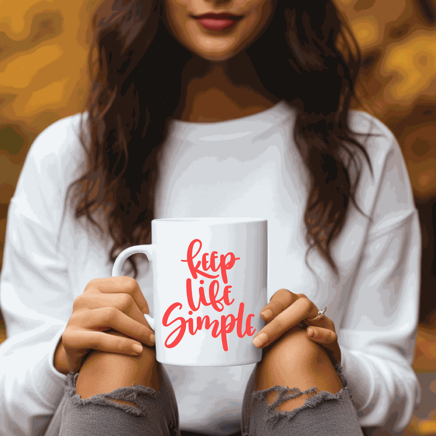 White ceramic coffee mug with "Keep Life Simple" printed in red, held by a woman in a cozy setting.