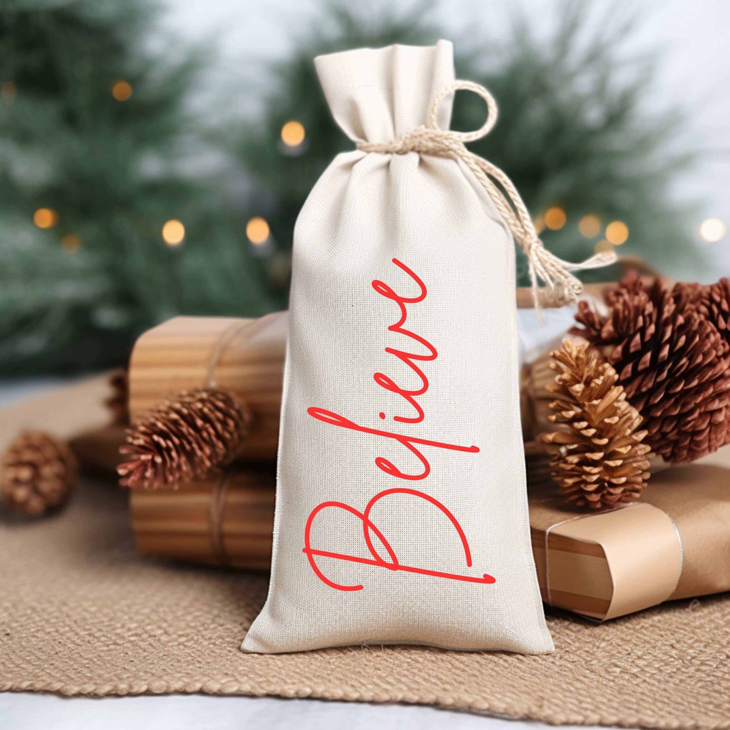 Custom holiday wine bag in canvas with "Believe" text, surrounded by festive decorations.