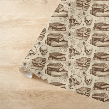 Gothic Halloween wrapping paper with skulls and books, ideal for spooky library-themed gifts.