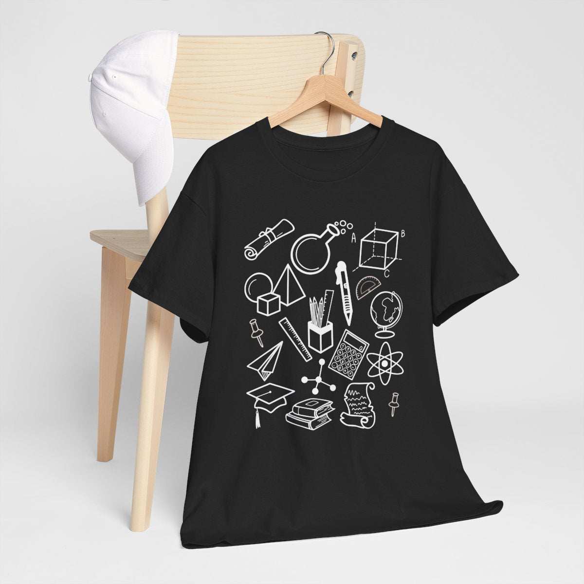 Trending teacher shirt with STEM science and math doodles, perfect gift for educators.