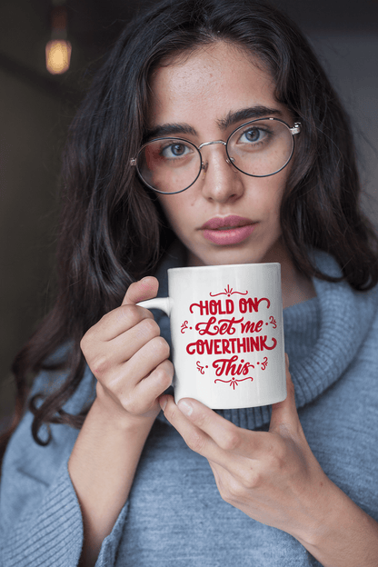 Funny personalized ceramic mug with "Hold on let me overthink this" in red text, available in 11 oz or 15 oz, perfect gift idea.