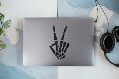 Skeleton hand peace sign decal sticker on laptop.