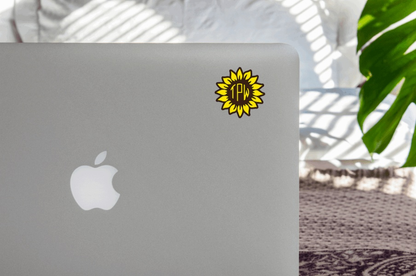 Sunflower Vinyl Monogram Decal on laptop surface.