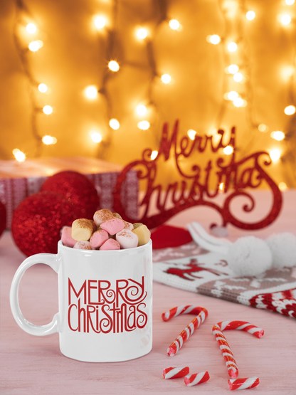 Merry Christmas Mug with marshmallows and festive background lights.