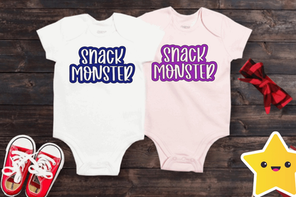 Unisex baby bodysuits with "Snack Monster" print in white and pink colors, displayed with red sneakers and bow.