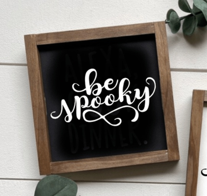 Handmade "Be Spooky" sign with black background and white lettering, wooden frame.