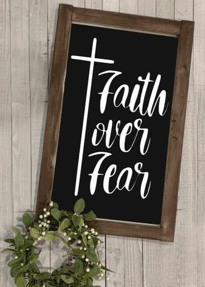 Faith over Fear rustic wood sign with stained frame and black background.