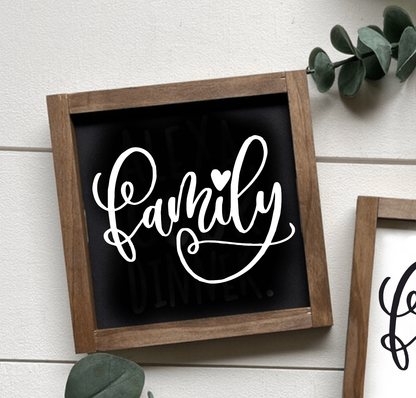 Handcrafted Family wood sign with black background and white lettering in a rustic frame.