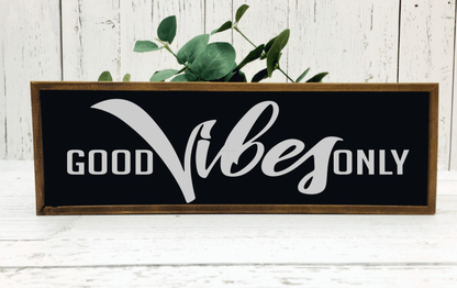 Handmade wood sign with "Good Vibes Only" lettering, dark background, stained pine frame, positive energy decor.