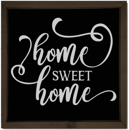 Handmade wood sign with "Home Sweet Home" text in white on a black background.