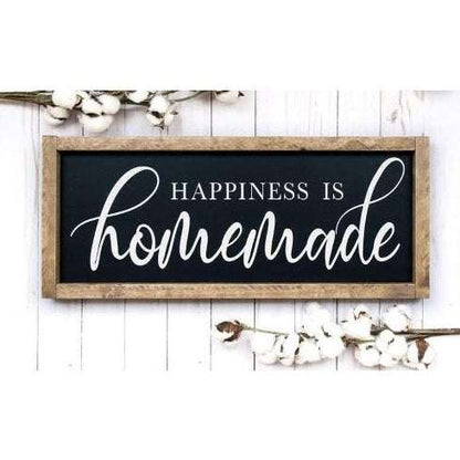 Handmade wood sign with "Happiness is Homemade" in white lettering, black background, framed with stained wood, perfect for kitchen or family room décor.