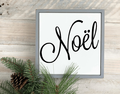 Handcrafted Noël framed wood sign with white background and black lettering, festive home decor.