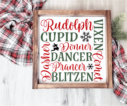 Handmade wood Christmas sign with reindeer names in red and green on a white background, framed in stained wood.