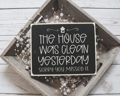 Handmade wood sign with "The House was Clean Yesterday" quote, black background, rustic decor.